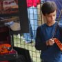 Young boy trying out a fiddle.  He was an excellent fiddle player!