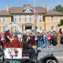 Outhouse racing teams on parade.